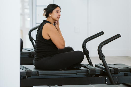 Woman sitting on Stellar Bodies machine