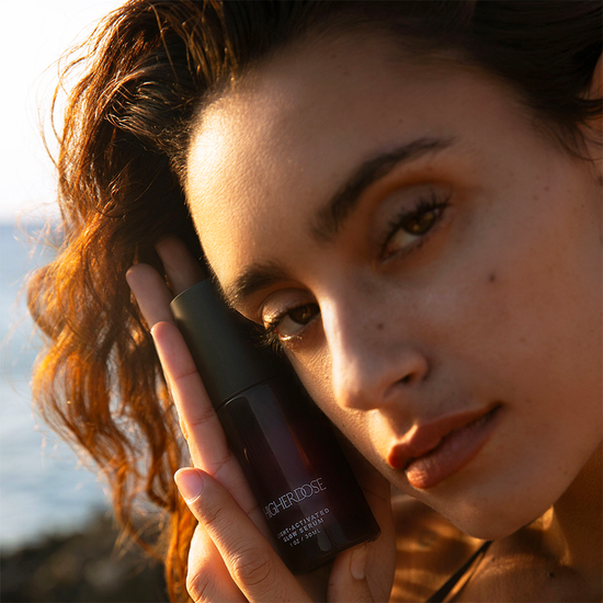 glow body serum close up with model